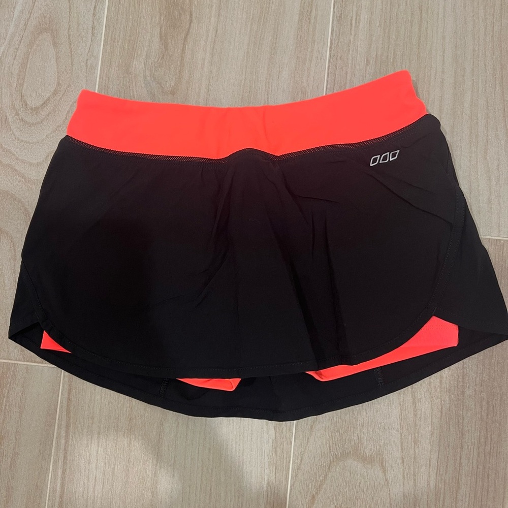 Lorna Jane Black and Orange Tennis Skirt